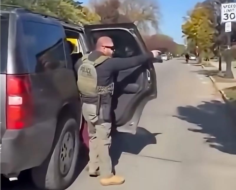 Timothy Donahue was caught on video pointing his gun at onlookers.