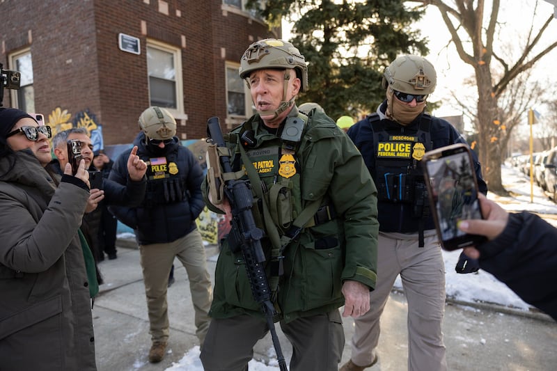 U.S. Border Patrol Cmdr. Gregory Bovino is confronted by residents and protesters