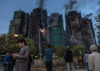 With elections following deadly fire, Hong Kong moves to stifle dissent