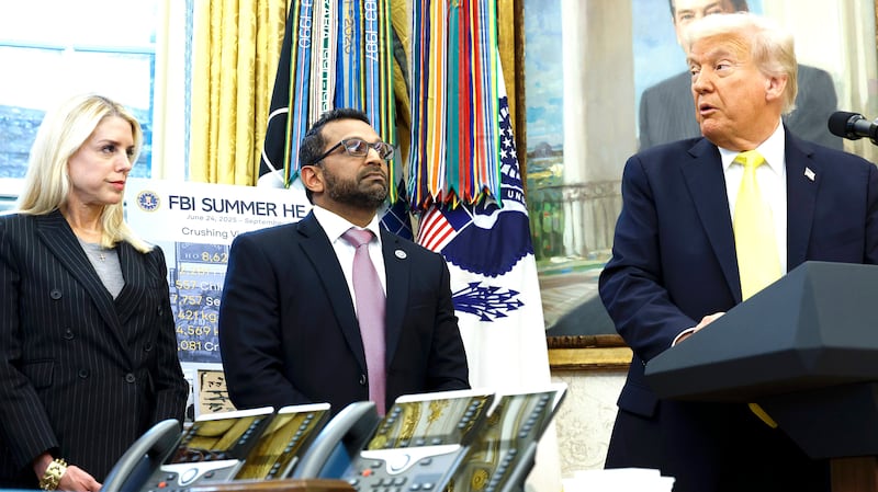 U.S. Attorney General Pam Bondi and Federal Bureau of Investigation Director Kash Patel look on as U.S. President Donald Trump speaks