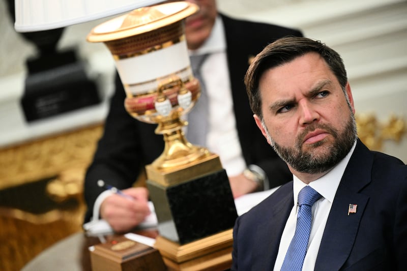 US Vice President JD Vance looks on during a meeting with US President Donald Trump and Crown Prince and Prime Minister of the Kingdom of Saudi Arabia Mohammed bin Salman in the Oval Office of the White House in Washington, DC on November 18, 2025. Saudi Crown Prince Mohammed bin Salman arrived at the White House to fanfare and a jet flyover Tuesday, in his first visit to the United States since the 2018 murder of journalist Jamal Khashoggi. (Photo by Brendan SMIALOWSKI / AFP)