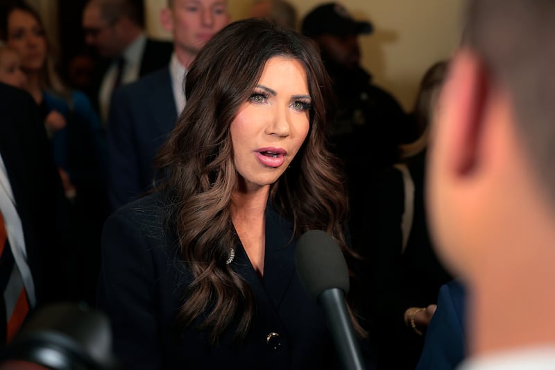 Homeland Security Secretary Kristi Noem speaks to members of the media as she arrives to testify before the House Homeland Security Committee on December 11, 2025.