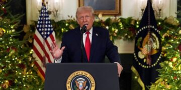 Fast, harsh, alone: Trump beams into primetime from an unusual footing