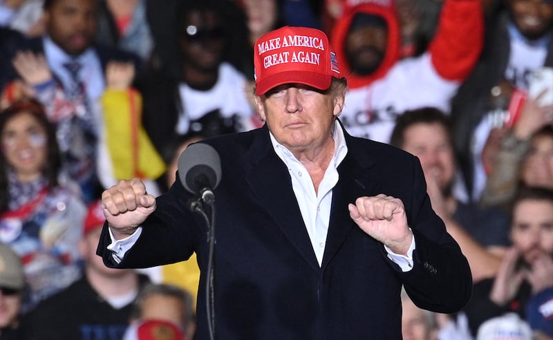 Donald Trump gestures as he speaks during a rally at the Canyon Moon Ranch festival grounds in Florence, Arizona, southeast of Phoenix, on January 15, 2022.