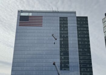 Workers rescued after window-washing platform on high-rise comes undone