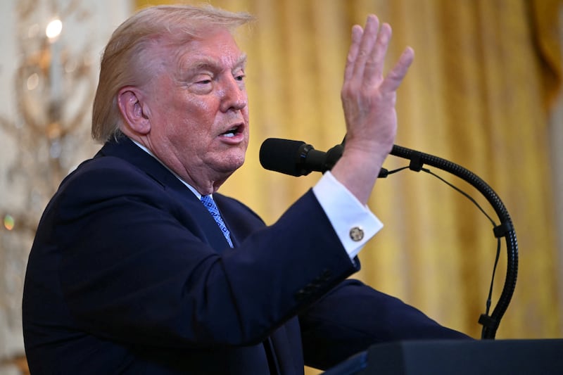 President Donald Trump speaks at a Hanukkah reception in the East Room of the White House in Washington, DC on December 16, 2025.