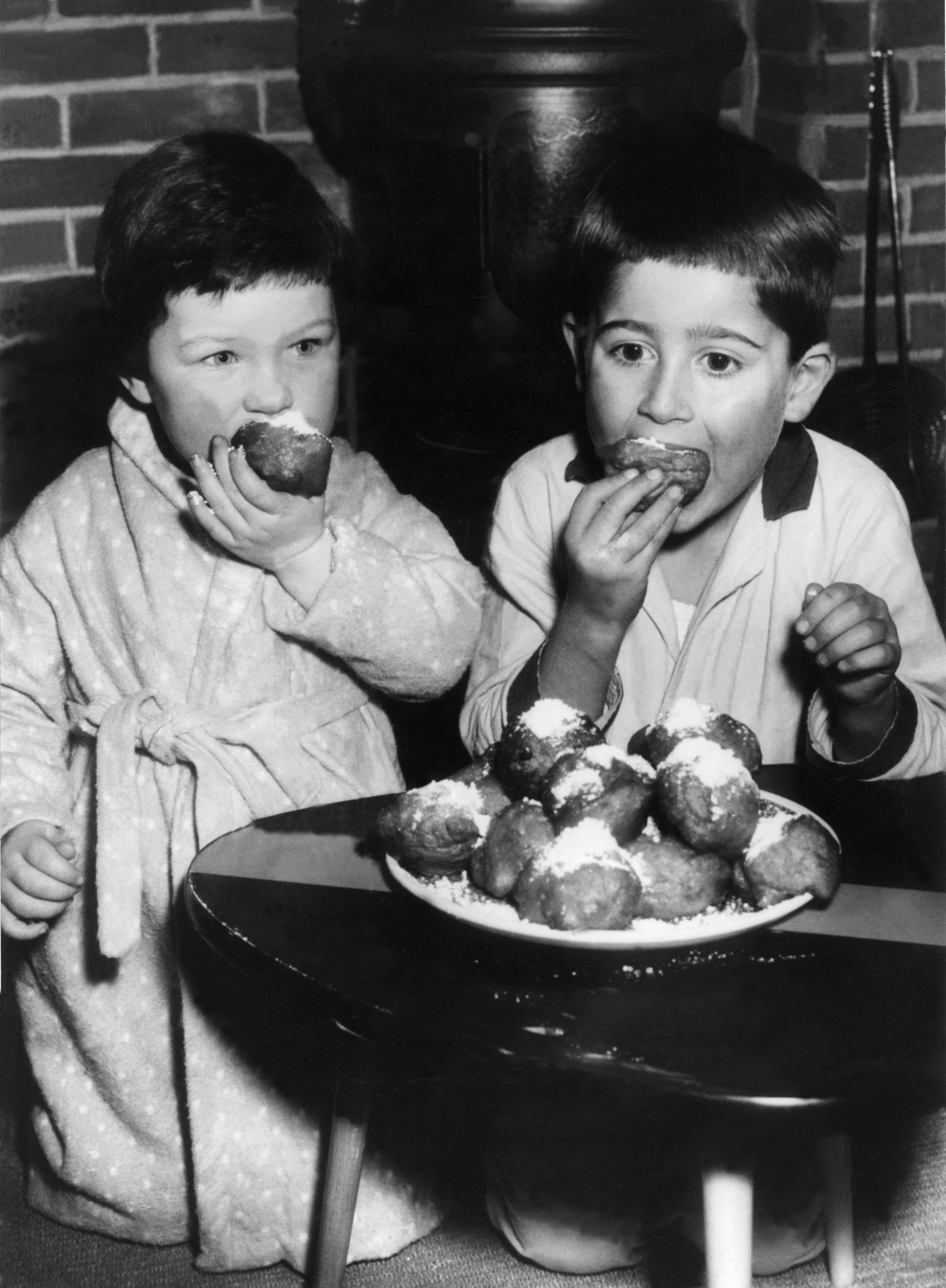 Two Dutch Children Eat Doughnut In 1959