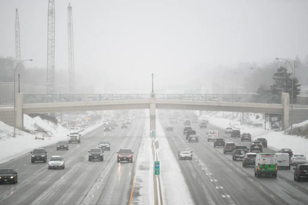 Highway traffic on a snowy day.