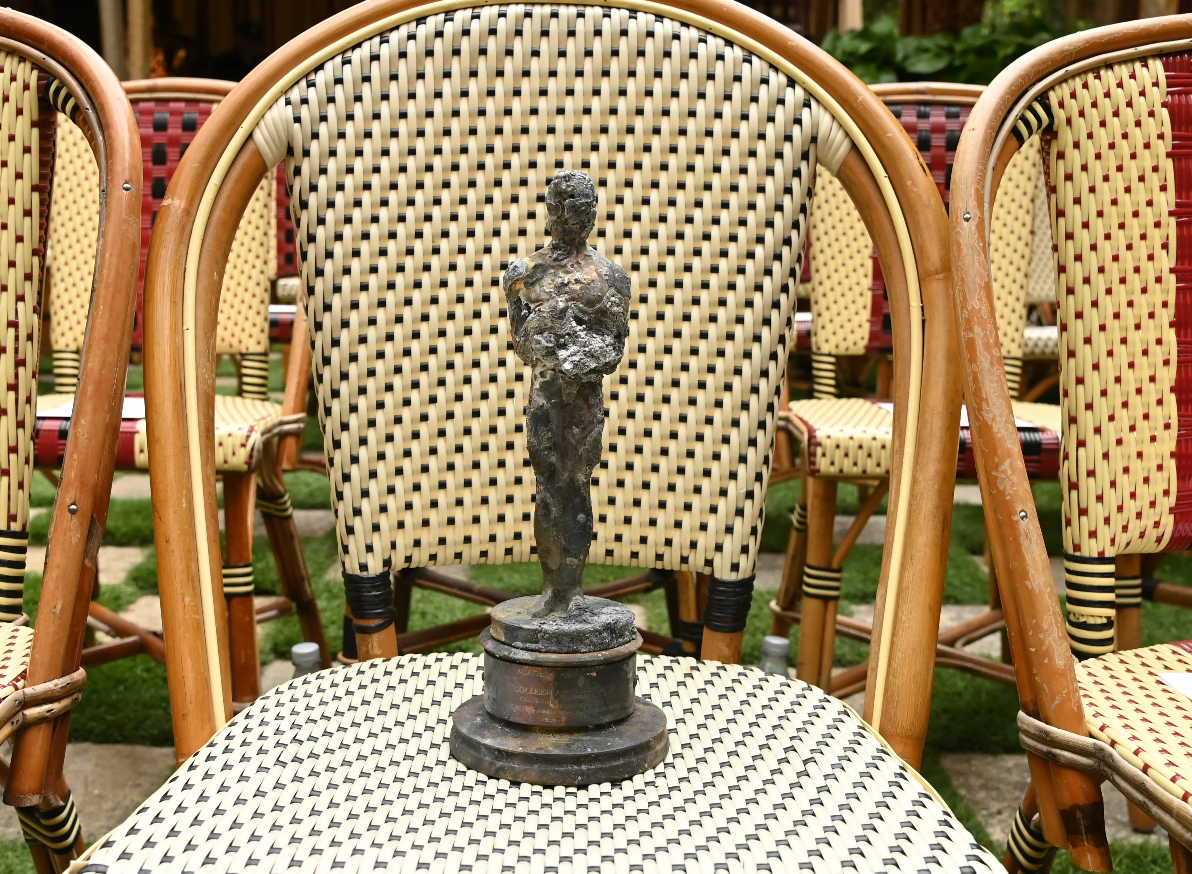 An Academy Award statue that’s been damaged from the Palisades fire