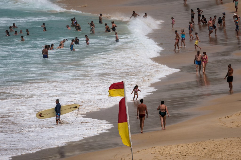 Beachgoers in the water of Bondi Beach in Sydney, Australia on Oct. 22, 2025.