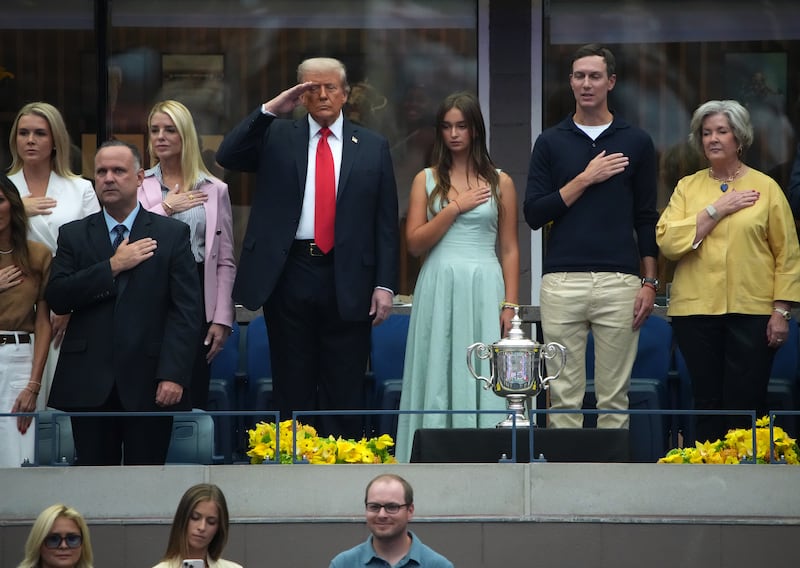 NEW YORK, NEW YORK - SEPTEMBER 07: (L-R) White House press secretary Karoline Leavitt, White House deputy Chief of Staff Dan Scavino, U.S. Attorney General Pam Bondi, U.S. President Donald Trump, Arabella Kushner, Jared Kushner and White House Chief of Staff Susie Wiles listen to the singing of the National Anthem before the start of the U.S. Open men's singles final at the Billie Jean King National Tennis Center for the U.S. Open finals on September 7, 2025 in New York City. President Trump is attending the U.S. Open men’s singles final between Carlos Alcaraz and Jannik Sinner. (Photo by Kevin Dietsch/Getty Images)