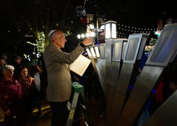 Hanukkah celebration at scene of firebombing expresses Jewish resilience