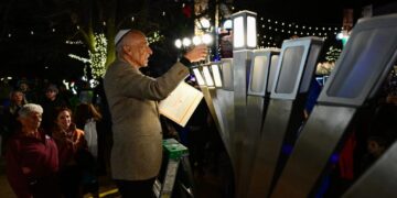 Hanukkah celebration at scene of firebombing expresses Jewish resilience