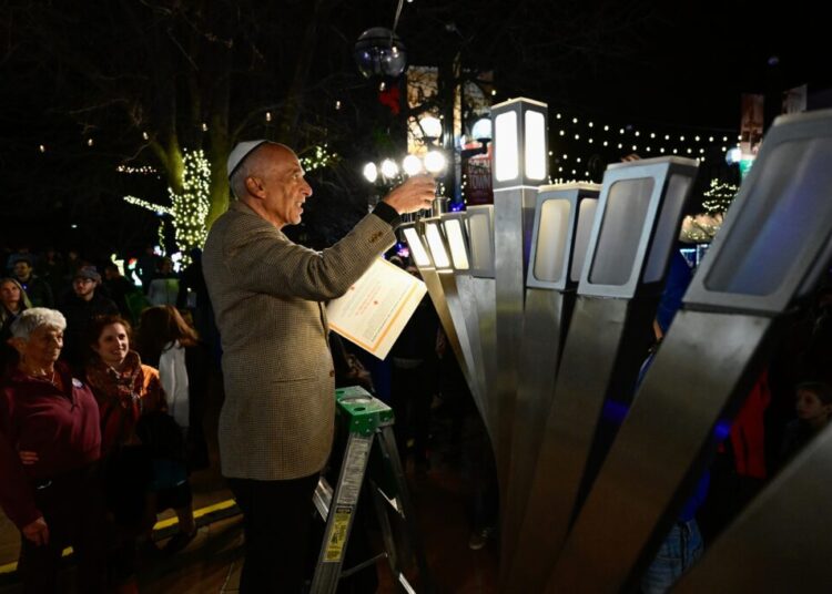 Hanukkah celebration at scene of firebombing expresses Jewish resilience