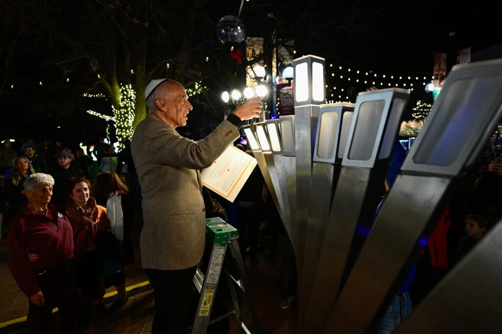 Hanukkah celebration at scene of firebombing expresses Jewish resilience