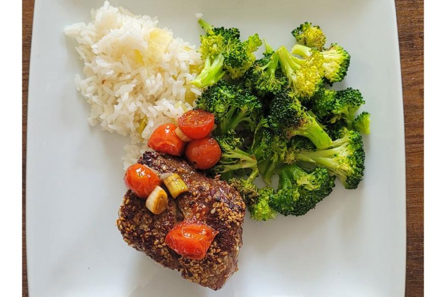 A steak, broccoli, and rice dish.