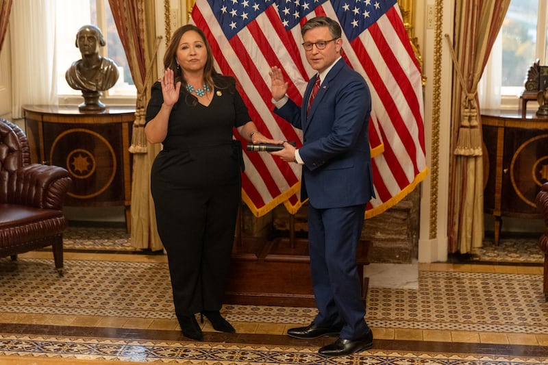 WASHINGTON, DC - NOVEMBER 12: House Speaker Mike Johnson (R-LA) performs a ceremonial swearing in ceremony with Congresswoman Adelita Grijalva (D-AZ) at the U.S. Capitol in Washington, DC on November 12, 2025.