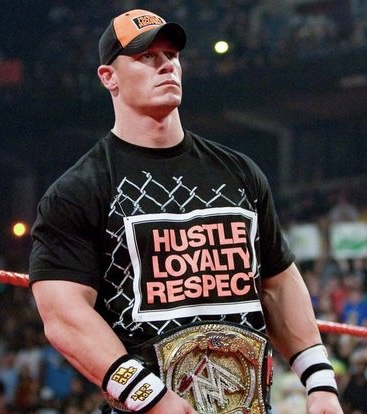 John Cena wearing a hustle, loyalty, and respect shirt.