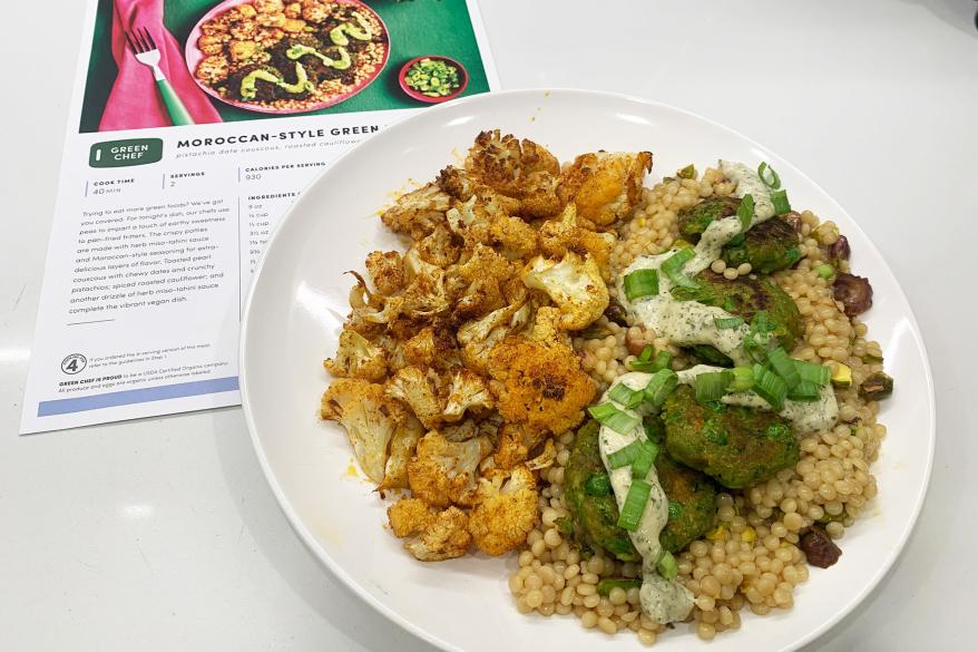 A plate of food next to a photo of that recipe