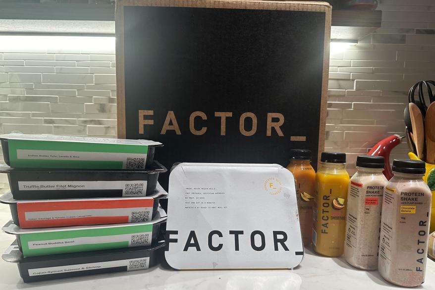 A box of food and drinks on a counter