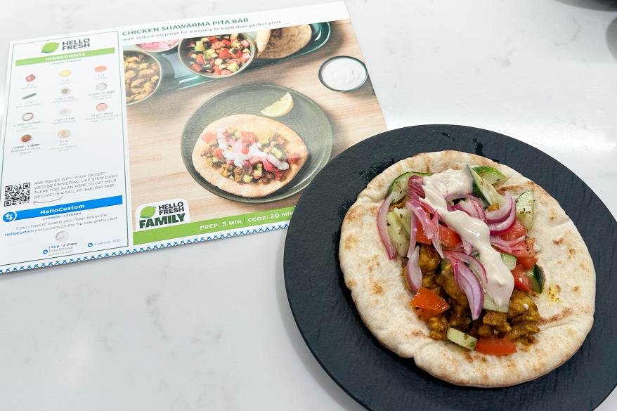 A plate of food next to a menu