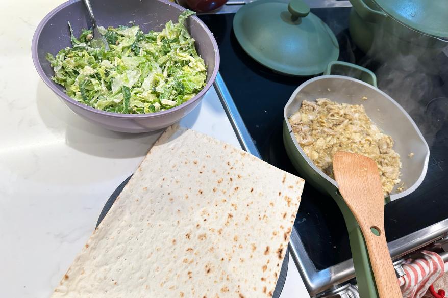 A plate of food cooking on a stove
