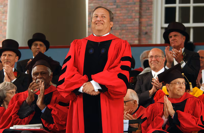 CAMBRIDGE, MA - JUNE 7: Former Harvard President Larry Summers receives applause from Microsoft co-founder and Chairman Bill Gates (R) and former NBA star Bill Russell (L) during commencement ceremonies at Harvard University June 7, 2007 in Cambridge, Massachusetts. Gates, who enrolled at Harvard in a pre-law program in 1973 and left in his junior year, received an honorary Doctor of Laws degree.