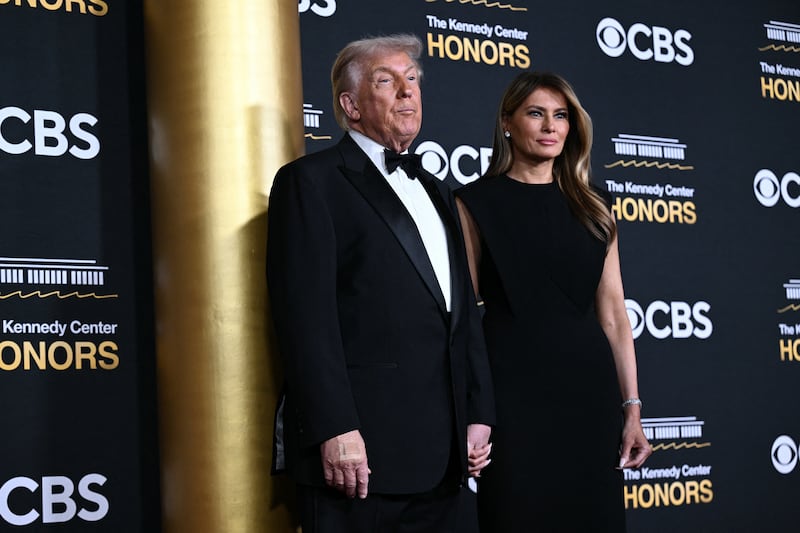 US President Donald Trump and First Lady Melania Trump arrive for the 48th Kennedy Center Honors gala at the Kennedy Center in Washington, DC, on December 7, 2025.