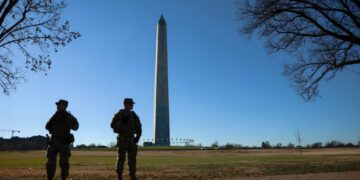 Alleged National Guard shooter makes first court appearance from hospital bed