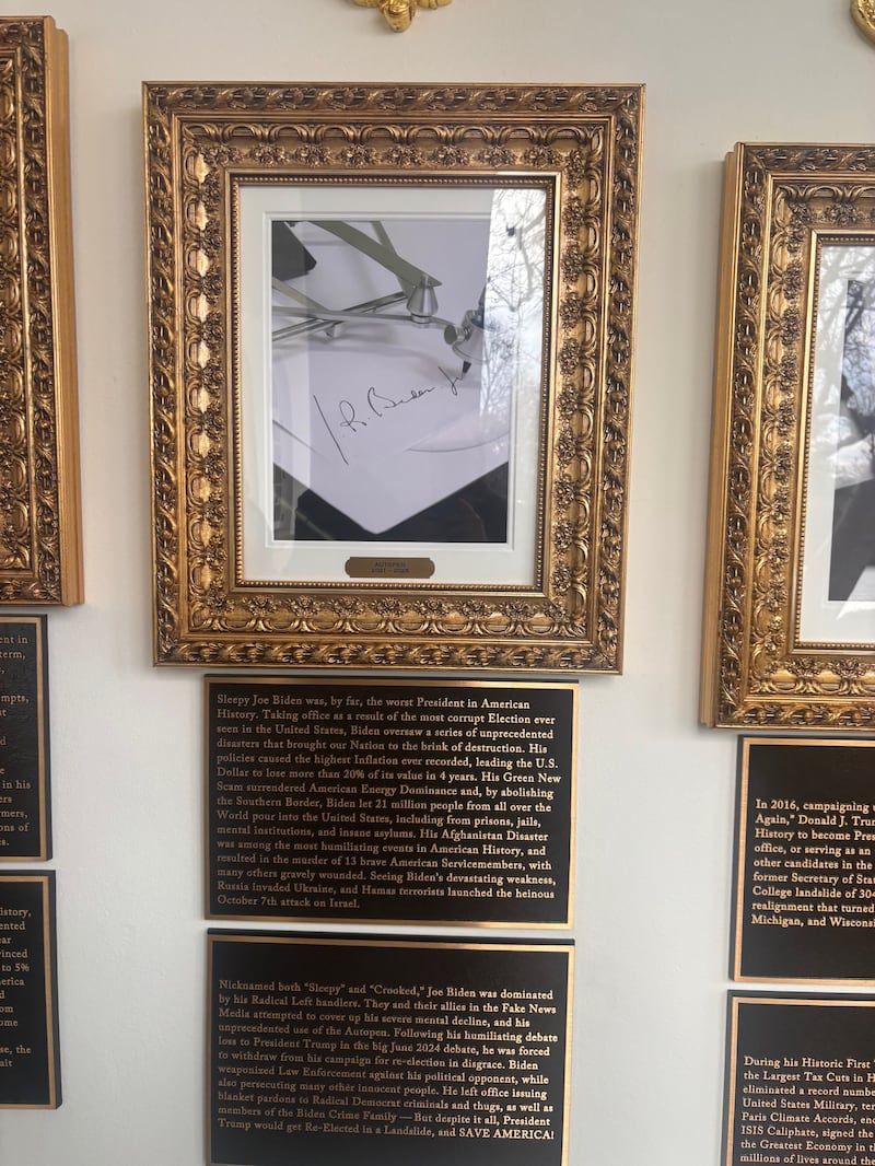 The new signage under the image of an autopen meant to represent President Biden on Donald Trump's