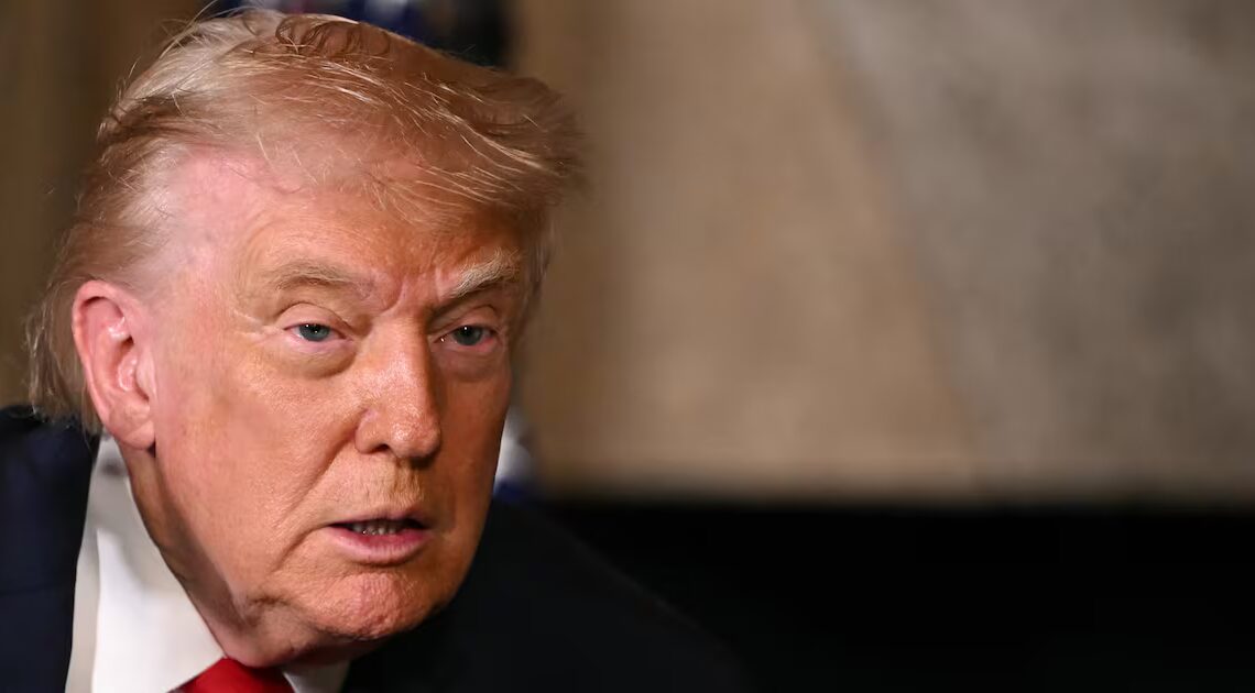 Trump, 79, Slathers On His Trusty Hand Makeup for the Holidays