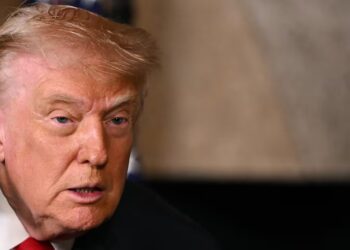 Trump, 79, Slathers On His Trusty Hand Makeup for the Holidays