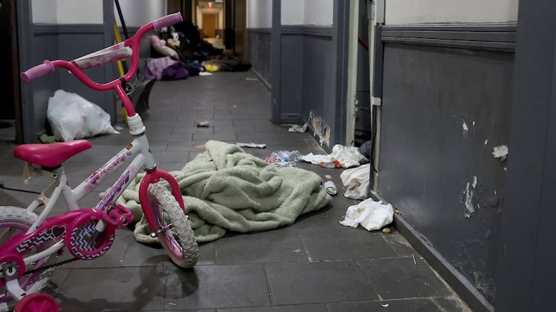 A pink bicycle, diapers, and clothing are scattered about the second floor hallway following a raid by U.S. Immigration and Customs Enforcement agents the previous week at 7500 S. South Shore Drive in Chicago, on Oct. 6, 2025.