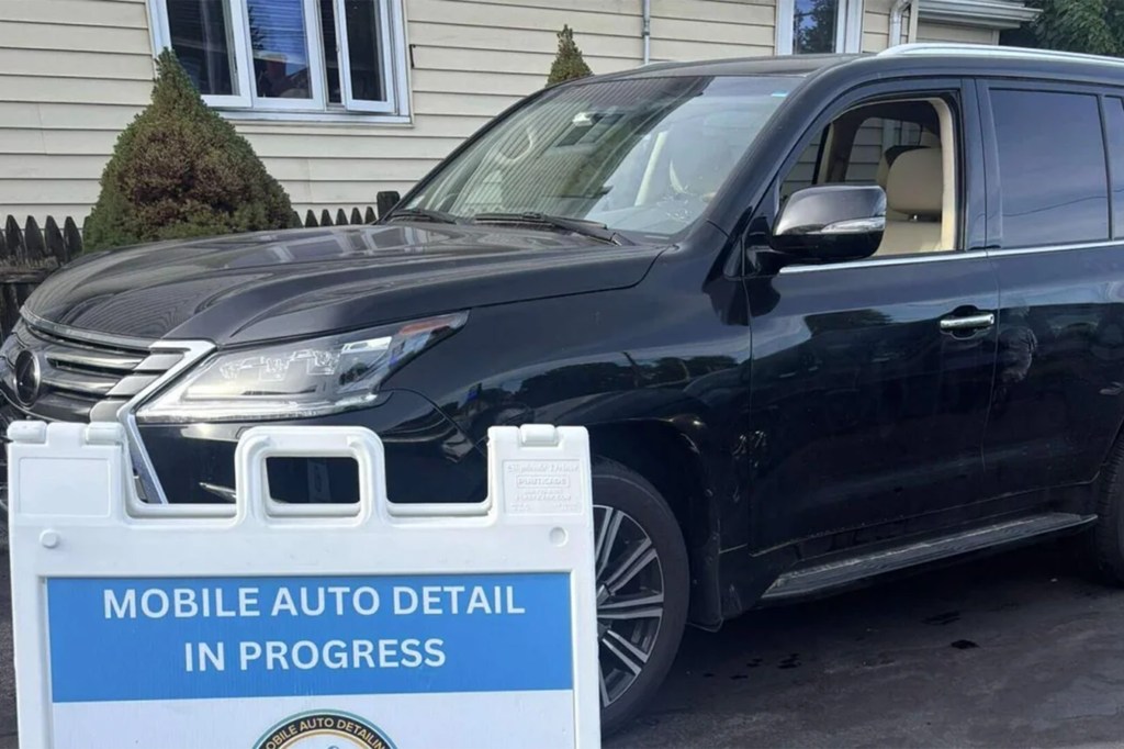 A black Lexus SUV with a