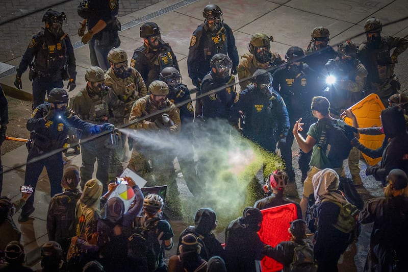 Protesters clash with law enforcement outside an Immigration and Customs Enforcement (ICE) facility in Portland on June 25, 2025 in Portland, Oregon.