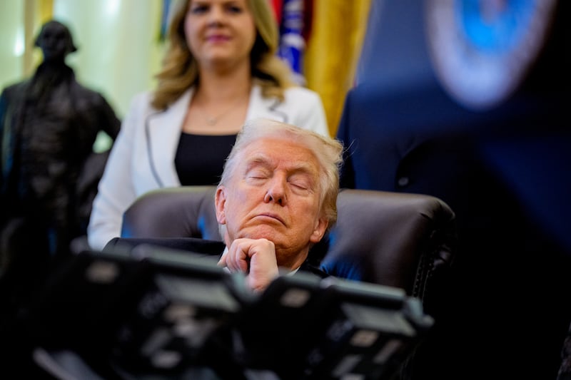 Donald Trump closing his eyes in the Oval Office