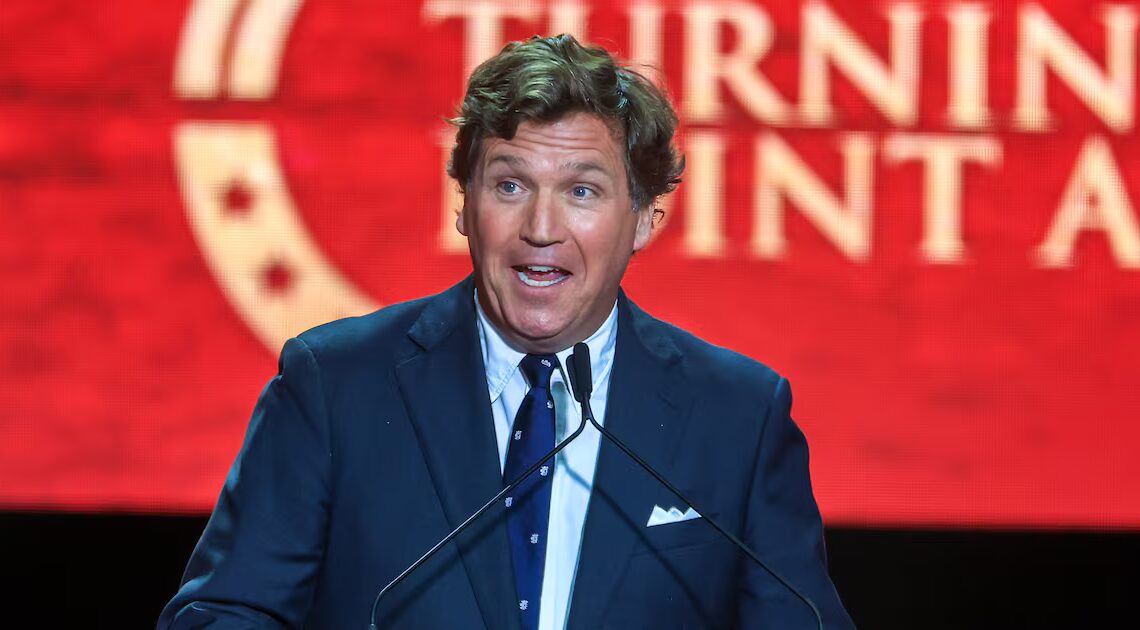 Tucker Carlson Met With Awkward Silence on Stage From MAGA Crowd