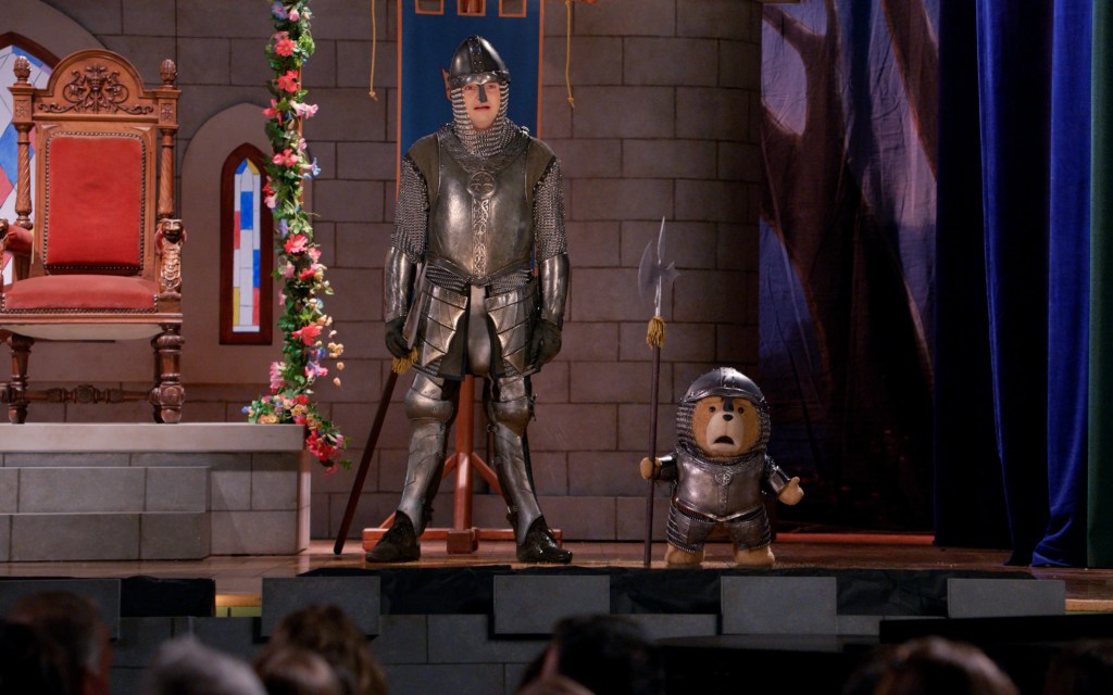 John (Max Burkholder) and Ted dressed as knights on stage for a play