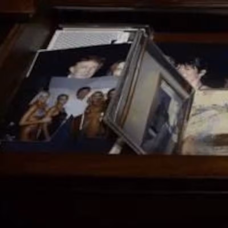 Epstein's desk featuring a picture of Trump and Epstein.