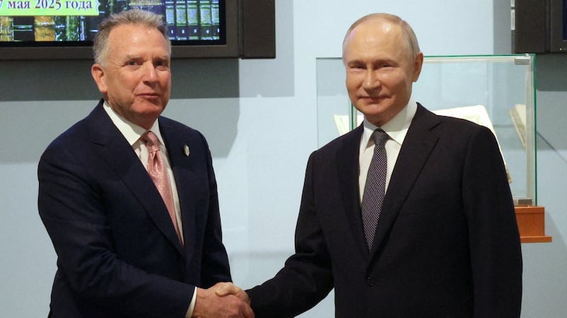 Steve Witkoff shaking hands with Vladimir Putin.
