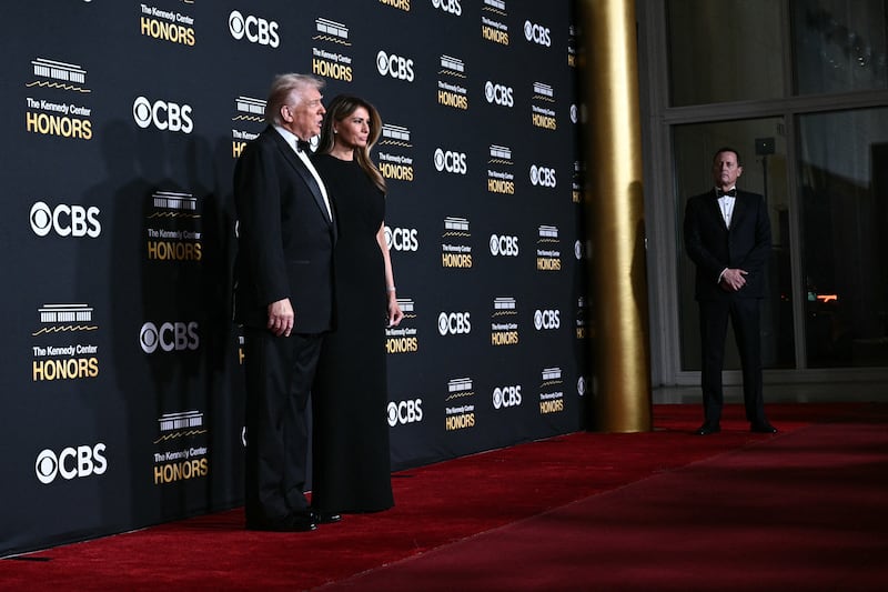 U.S. President Donald Trump and First Lady Melania Trump arrive for the 48th Kennedy Center Honors gala s the Interim Executive Director/President of the Kennedy Center Richard Grenell (R) looks on.