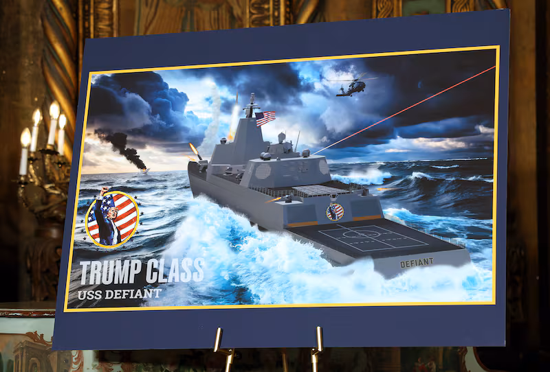 PALM BEACH, FLORIDA - DECEMBER 22: An artist rendering of the newly announced “Trump-class” battleship is displayed as President Donald Trump announces the new Naval ship class during a statement to the media at his Mar-a-Lago estate on December 22, 2025 in Palm Beach, Florida. Trump announced the new class of ship will become the centerpiece of his “Golden Fleet” program to rebuild and strengthen the U.S. shipbuilding industry. (Photo by Tasos Katopodis/Getty Images)
