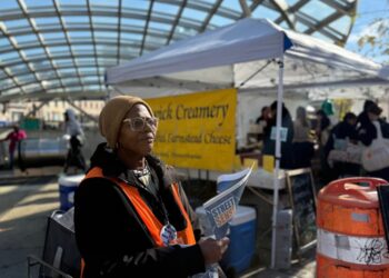At a farmers market, news on the homeless, hawked by a woman who lived it