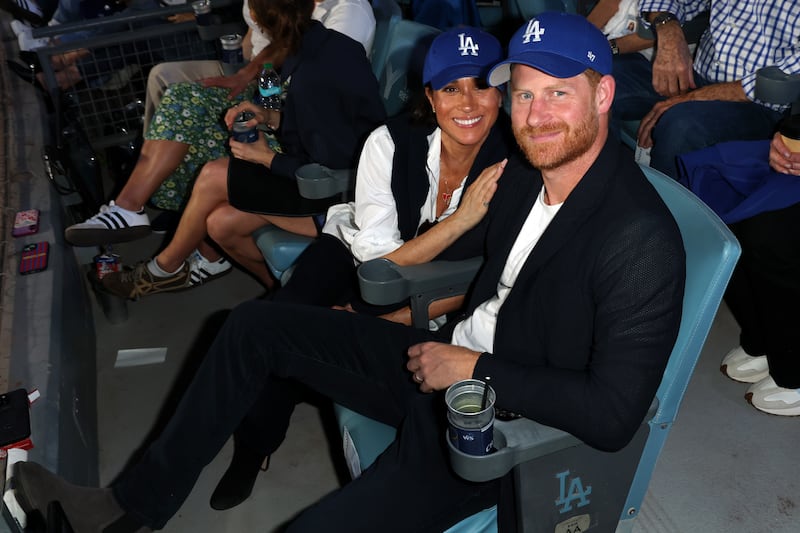 LOS ANGELES, CA - OCTOBER 28: Prince Harry, Duke of Sussex and Meghan, Duchess of Sussex pose for a photo during Game Four of the 2025 World Series presented by Capital One between the Toronto Blue Jays and the Los Angeles Dodgers at Dodger Stadium on Tuesday, October 28, 2025 in Los Angeles, California.