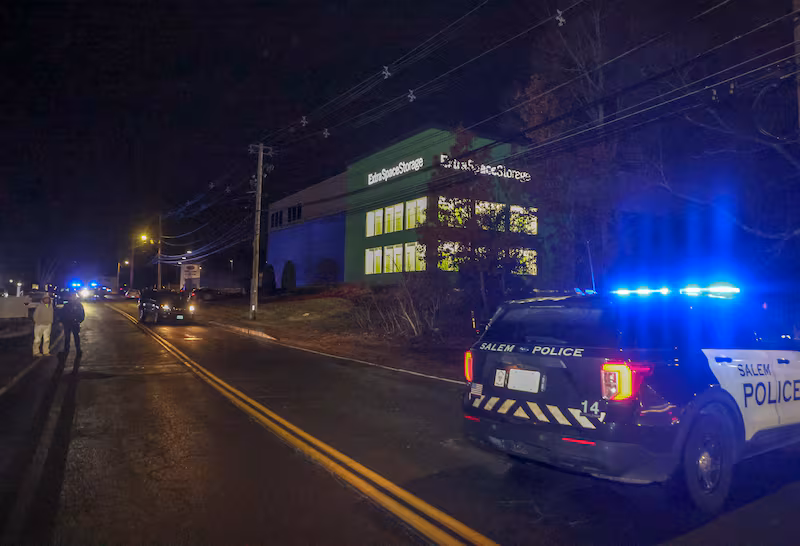 Police on scene at the Extra Space Storage facility where the Brown University shooting suspect was found dead on December 18, 2025.