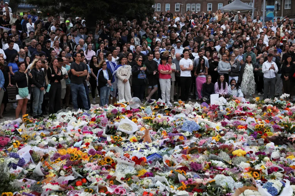 People pay respects at Bondi Pavilion to victims of a shooting during a Jewish holiday celebration at Bondi Beach, in Sydney, Australia, December 15, 2025.