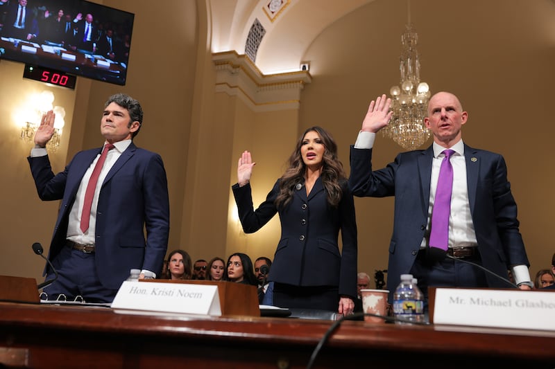 Director of the National Counterterrorism Center Joseph Kent, Secretary of Homeland Security Kristi Noem, and Operations Director of the National Security Branch at the FBI Michael Glasheen are sworn-in prior to testifying before the House Homeland Security Committee on December 11, 2025.