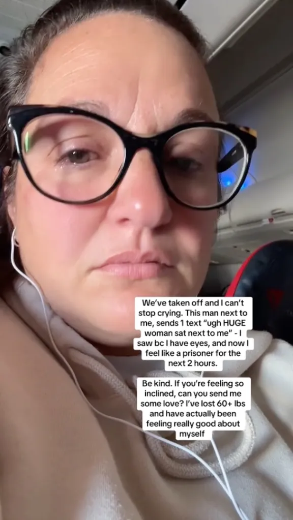 A woman crying on an airplane after a man next to her texted a rude comment about her weight.