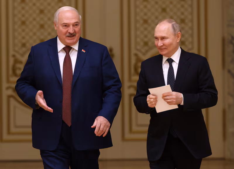 Russian President Vladimir Putin and Belarussian President Alexander Lukashenko enter the hall during their meeting at the Palace of Independence,  on May 24, 2024, in Minsk, Belarus.