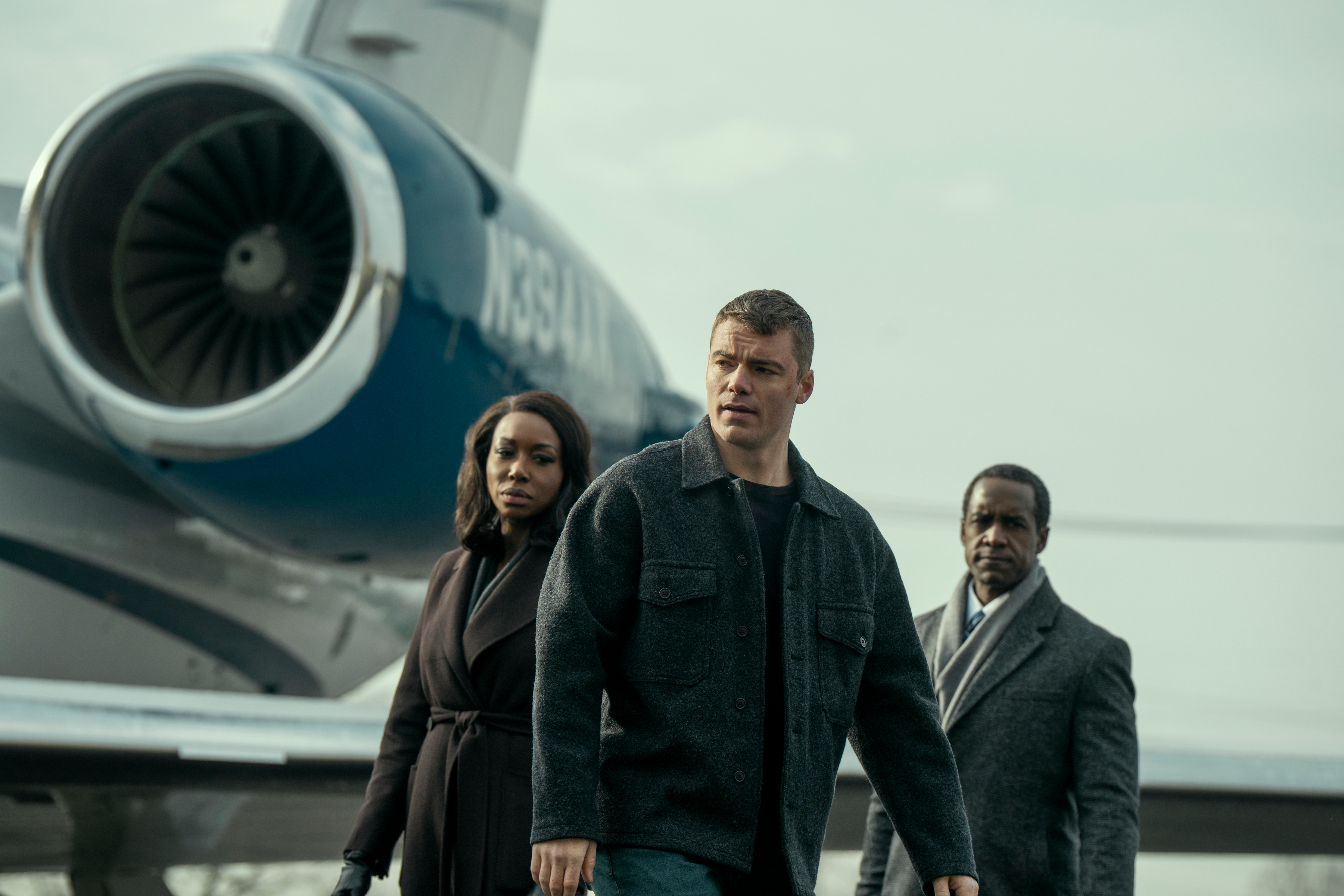 The Night Agent. (L to R) Amanda Warren as Catherine Weaver, Gabriel Basso as Peter Sutherland, Albert Jones as Deputy Director Aiden Mosley in episode 302 of The Night Agent. Cr. Christopher Saunders/Netflix © 2025
